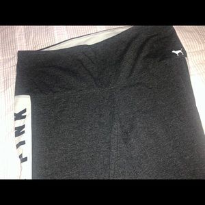 Pink Yogas with logo down the leg